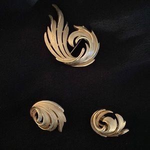 Trifari gold colored metal swirl broach and clip-on earrings - set of 3 pieces